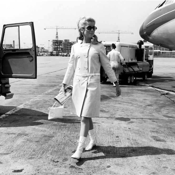 Catherine Deneuve wearing Courrèges, at London Airport in 1965.