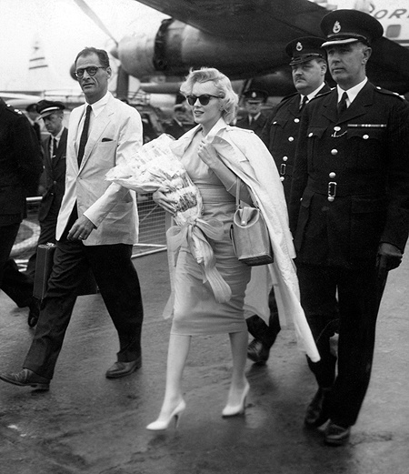 Marilyn Monroe and husband Arthur Miller touch down in London to begin work on The Prince and the Showgirl