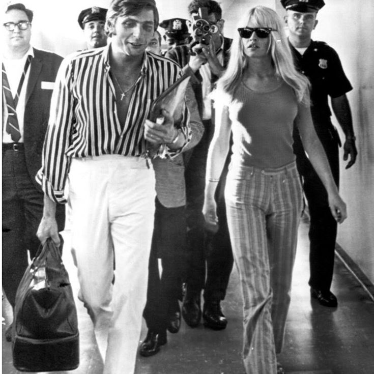 Bridget Bardot catching a connecting flight at JFK to Geneva, returning from her honeymoon in Mexico.